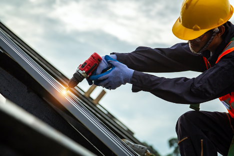 worker constructing new roof