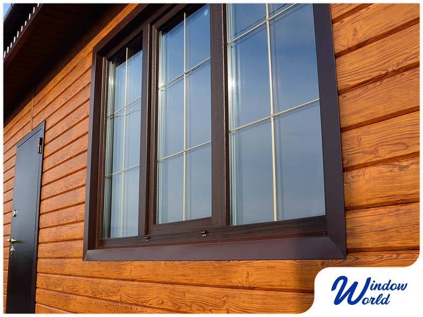 black framed windows wood siding