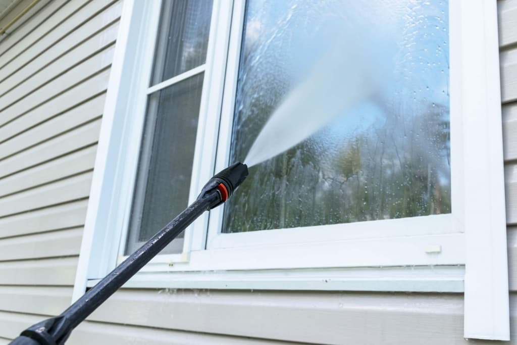 pressure-washer-cleaning-window-world-of-boston